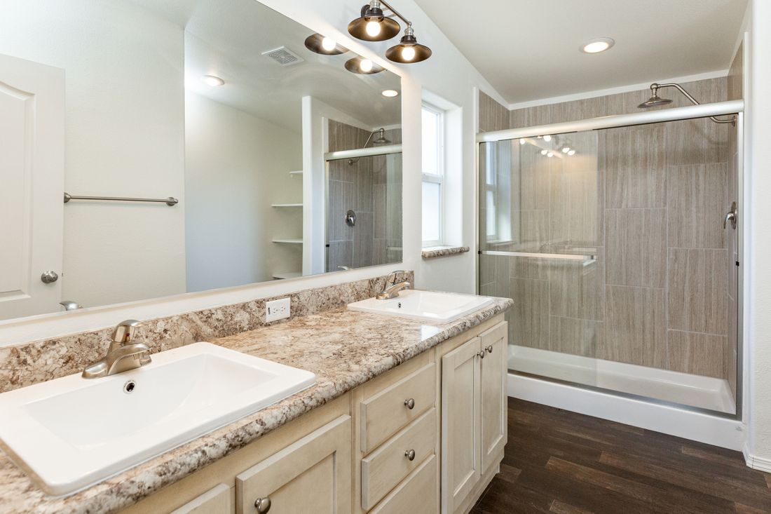 The 2017 COLUMBIA RIVER Primary Bathroom. This Manufactured Mobile Home features 3 bedrooms and 2 baths.
