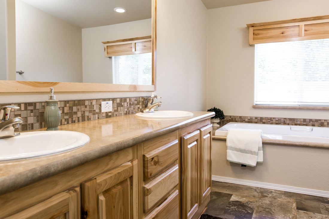 The 9590S BLACKMORE Primary Bathroom. This Manufactured Mobile Home features 3 bedrooms and 2 baths.