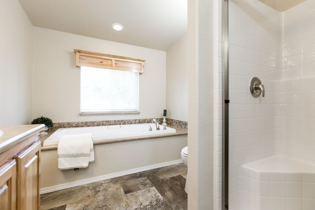 The 9590S BLACKMORE Primary Bathroom. This Manufactured Mobile Home features 3 bedrooms and 2 baths.